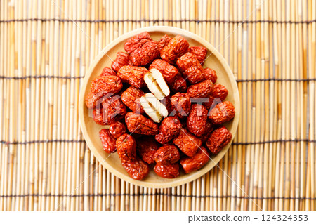 Dried red Chinese dates, jujube in a bowl 124324353