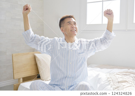 Middle-aged man stretching and waking up 124324826