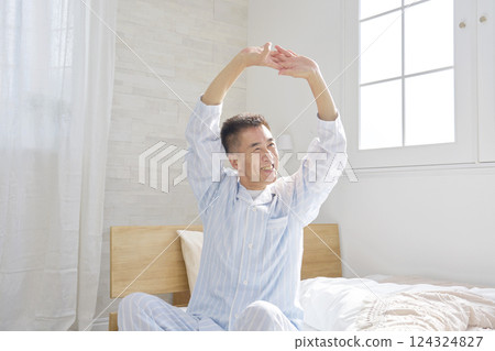 Middle-aged man stretching and waking up 124324827