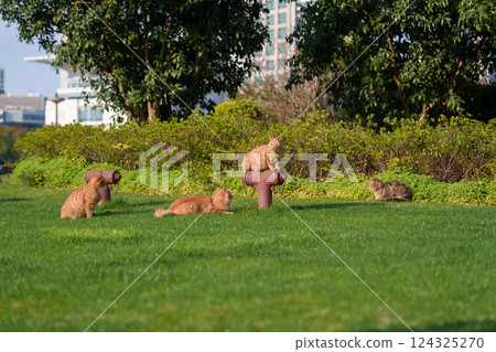 Orange cat playing on the grass 124325270