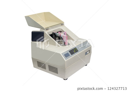 Closeup view of automatic money counting machine for currency exchange or cash deposit isolated over white background. Concept of finance, banking, and investment Closeup view of automatic money counting machine for currency exchange or cash deposit isolated over white background. Concept of finance, banking, and investment 124327713