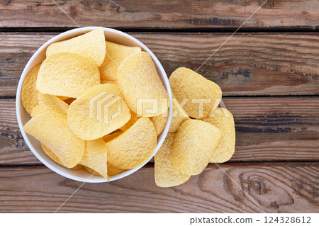 Potato chips in a saucer Potato chips in a saucer 124328612