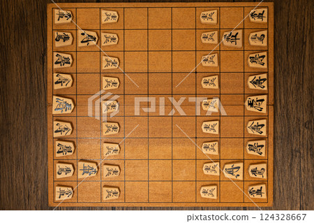 Shogi pieces are lined up on the shogi board 124328667