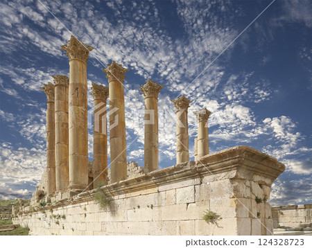 Temple of Zeus, Jordanian city of Jerash  (Gerasa of Antiquity), capital and largest city of Jerash Governorate, Jordan. Against the background of a beautiful sky with clouds 124328723