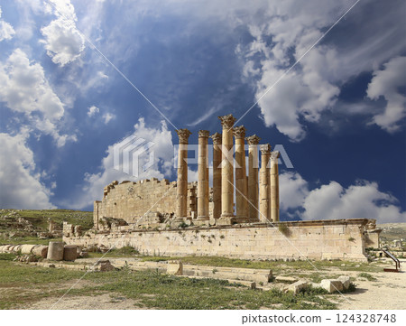 Temple of Zeus, Jordanian city of Jerash (Gerasa of Antiquity), capital and largest city of Jerash Governorate, Jordan. Against the background of a beautiful sky with clouds Temple of Zeus, Jordanian city of Jerash (Gerasa of Antiquity), capital and largest city of Jerash Governorate, Jordan. Against the background of a beautiful sky with clouds 124328748