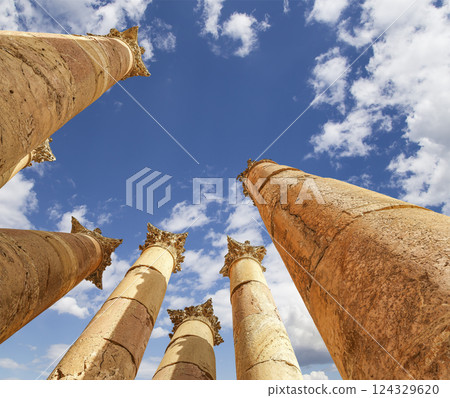 Roman Columns in the Jordanian city of Jerash (Gerasa of Antiquity), capital and largest city of Jerash Governorate, Jordan. Against the background of a beautiful sky with clouds Roman Columns in the Jordanian city of Jerash (Gerasa of Antiquity), capital and largest city of Jerash Governorate, Jordan. Against the background of a beautiful sky with clouds 124329620