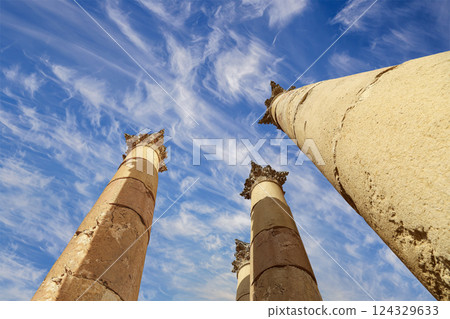 Roman Columns in the Jordanian city of Jerash (Gerasa of Antiquity), capital and largest city of Jerash Governorate, Jordan. Against the background of a beautiful sky with clouds Roman Columns in the Jordanian city of Jerash (Gerasa of Antiquity), capital and largest city of Jerash Governorate, Jordan. Against the background of a beautiful sky with clouds 124329633