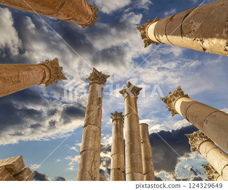 Roman Columns in the Jordanian city of Jerash (Gerasa of Antiquity), capital and largest city of Jerash Governorate, Jordan. Against the background of a beautiful sky with clouds 124329649