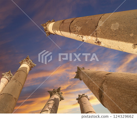 Roman Columns in the Jordanian city of Jerash (Gerasa of Antiquity), capital and largest city of Jerash Governorate, Jordan. Against the background of a beautiful sky with clouds Roman Columns in the Jordanian city of Jerash (Gerasa of Antiquity), capital and largest city of Jerash Governorate, Jordan. Against the background of a beautiful sky with clouds 124329662