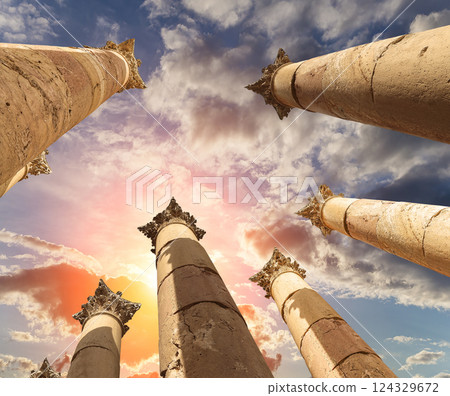 Roman Columns in the Jordanian city of Jerash (Gerasa of Antiquity), capital and largest city of Jerash Governorate, Jordan. Against the background of a beautiful sky with clouds 124329672