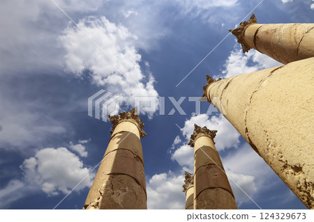 Roman Columns in the Jordanian city of Jerash (Gerasa of Antiquity), capital and largest city of Jerash Governorate, Jordan. Against the background of a beautiful sky with clouds Roman Columns in the Jordanian city of Jerash (Gerasa of Antiquity), capital and largest city of Jerash Governorate, Jordan. Against the background of a beautiful sky with clouds 124329673