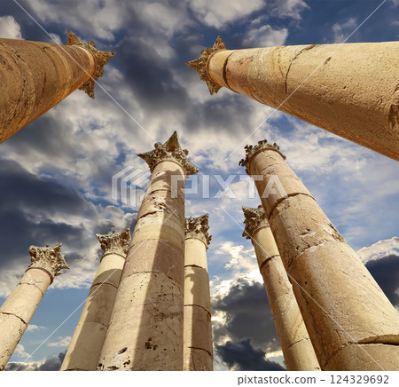 Roman Columns in the Jordanian city of Jerash (Gerasa of Antiquity), capital and largest city of Jerash Governorate, Jordan. Against the background of a beautiful sky with clouds 124329692