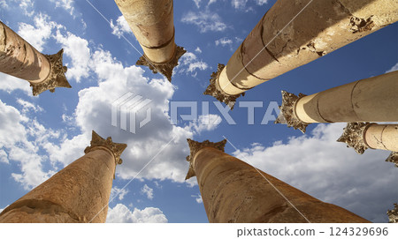 Roman Columns in the Jordanian city of Jerash (Gerasa of Antiquity), capital and largest city of Jerash Governorate, Jordan. Against the background of a beautiful sky with clouds 124329696