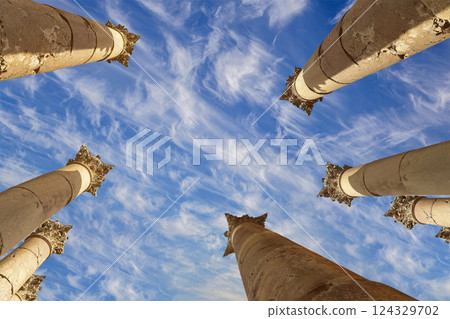 Roman Columns in the Jordanian city of Jerash (Gerasa of Antiquity), capital and largest city of Jerash Governorate, Jordan. Against the background of a beautiful sky with clouds Roman Columns in the Jordanian city of Jerash (Gerasa of Antiquity), capital and largest city of Jerash Governorate, Jordan. Against the background of a beautiful sky with clouds 124329702