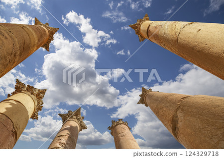 Roman Columns in the Jordanian city of Jerash (Gerasa of Antiquity), capital and largest city of Jerash Governorate, Jordan. Against the background of a beautiful sky with clouds Roman Columns in the Jordanian city of Jerash (Gerasa of Antiquity), capital and largest city of Jerash Governorate, Jordan. Against the background of a beautiful sky with clouds 124329718