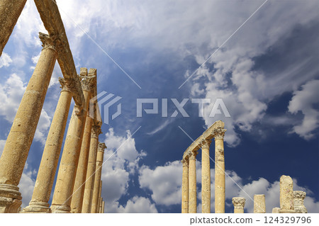 Roman Columns in the Jordanian city of Jerash (Gerasa of Antiquity), capital and largest city of Jerash Governorate, Jordan. Against the background of a beautiful sky with clouds 124329796