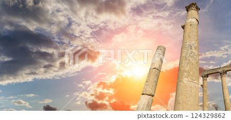 Roman Columns in the Jordanian city of Jerash (Gerasa of Antiquity), capital and largest city of Jerash Governorate, Jordan. Against the background of a beautiful sky with clouds Roman Columns in the Jordanian city of Jerash (Gerasa of Antiquity), capital and largest city of Jerash Governorate, Jordan. Against the background of a beautiful sky with clouds 124329862