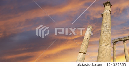 Roman Columns in the Jordanian city of Jerash (Gerasa of Antiquity), capital and largest city of Jerash Governorate, Jordan. Against the background of a beautiful sky with clouds Roman Columns in the Jordanian city of Jerash (Gerasa of Antiquity), capital and largest city of Jerash Governorate, Jordan. Against the background of a beautiful sky with clouds 124329863