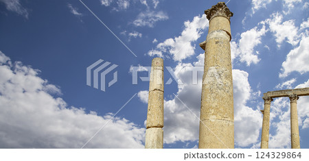 Roman Columns in the Jordanian city of Jerash (Gerasa of Antiquity), capital and largest city of Jerash Governorate, Jordan. Against the background of a beautiful sky with clouds Roman Columns in the Jordanian city of Jerash (Gerasa of Antiquity), capital and largest city of Jerash Governorate, Jordan. Against the background of a beautiful sky with clouds 124329864