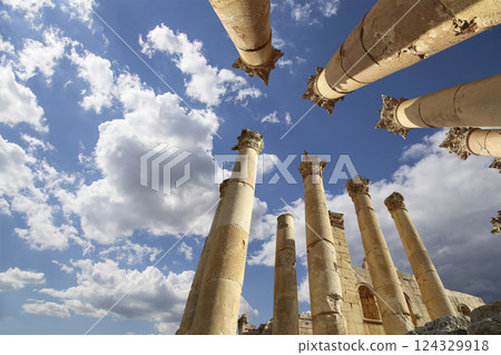 Roman Columns in the Jordanian city of Jerash (Gerasa of Antiquity), capital and largest city of Jerash Governorate, Jordan. Against the background of a beautiful sky with clouds Roman Columns in the Jordanian city of Jerash (Gerasa of Antiquity), capital and largest city of Jerash Governorate, Jordan. Against the background of a beautiful sky with clouds 124329918