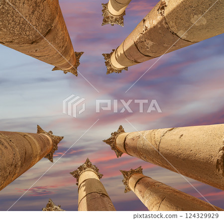 Roman Columns in the Jordanian city of Jerash (Gerasa of Antiquity), capital and largest city of Jerash Governorate, Jordan. Against the background of a beautiful sky with clouds Roman Columns in the Jordanian city of Jerash (Gerasa of Antiquity), capital and largest city of Jerash Governorate, Jordan. Against the background of a beautiful sky with clouds 124329929