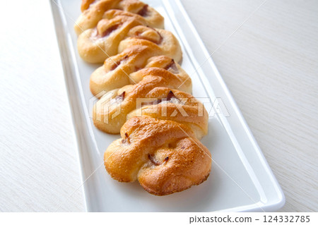 Bacon epi on a white plate 124332785