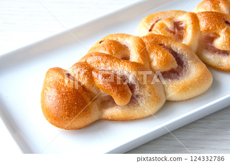 Bacon epi on a white plate 124332786