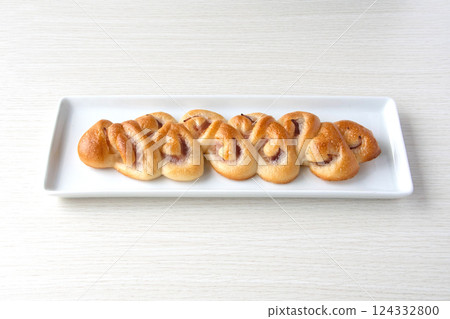 Bacon epi on a white plate 124332800