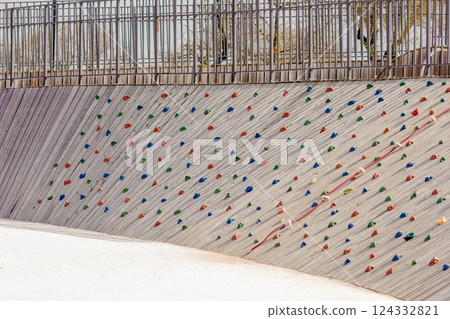 Artificial rock wall on playground in park 124332821