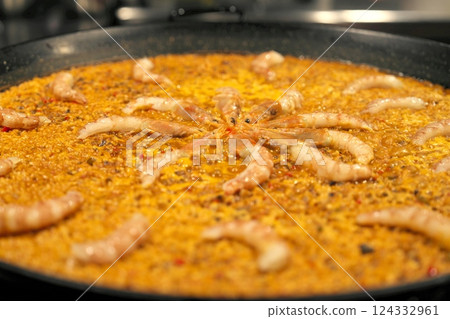 Paella being cooked 124332961