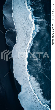 Breathtaking aerial view of powerful ocean waves crashing on black sand beach in iceland Breathtaking aerial view of powerful ocean waves crashing on black sand beach in iceland 124333107
