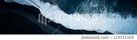 Breathtaking aerial view of powerful ocean waves crashing on black sand beach in iceland Breathtaking aerial view of powerful ocean waves crashing on black sand beach in iceland 124333108