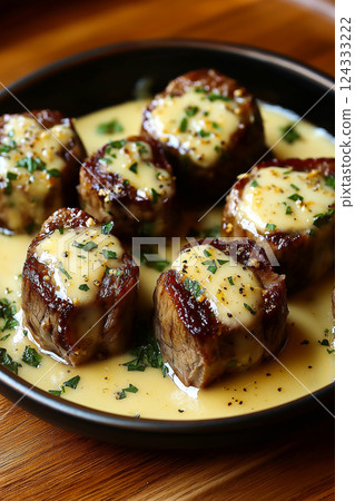 Delicious garlic butter steak bites drenched in creamy parmesan sauce Delicious garlic butter steak bites drenched in creamy parmesan sauce 124333222