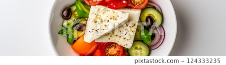 Greek salad with feta cheese, cucumber, tomato, onion and olives in a white bowl 124333235