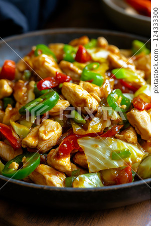 Chicken and cabbage stir fry with jalapeno peppers and sesame seeds Chicken and cabbage stir fry with jalapeno peppers and sesame seeds 124333300