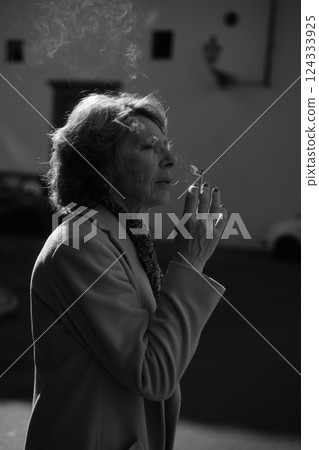 Woman Enjoying a Smoke in Black and White 124333925