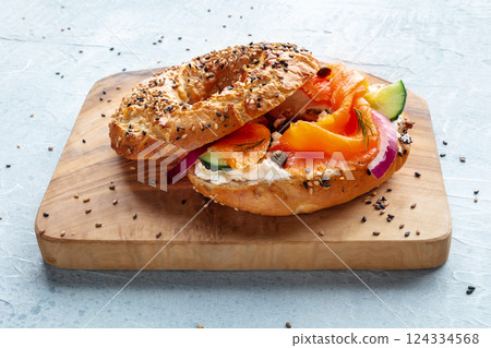 Lox bagel. A sandwich with smoked salmon and fresh vegetables 124334568
