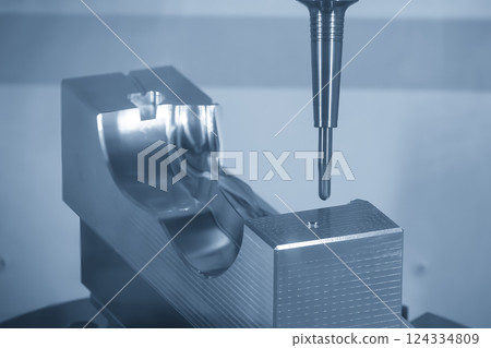 The CNC milling machine finish cut the injection mold parts by solid ball nose end mill tools in the light blue scene. The CNC milling machine finish cut the injection mold parts by solid ball nose end mill tools in the light blue scene. 124334809