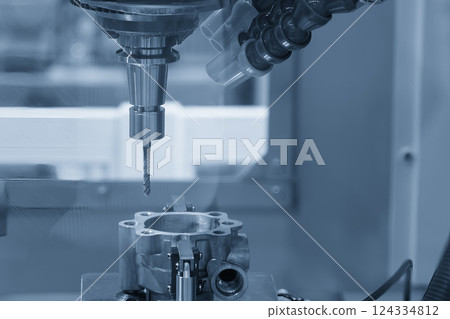 The tapping process on CNC milling machine in the light blue scene. 124334812