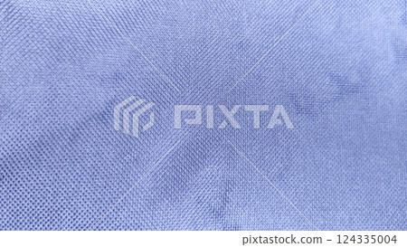 Close-up of textile canvas fabric texture, rough finish, blue color tone for background design. 124335004