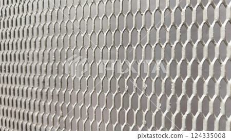 Close-up of expanded steel metal mesh texture, anodized finish, grey color tone for background design. 124335008
