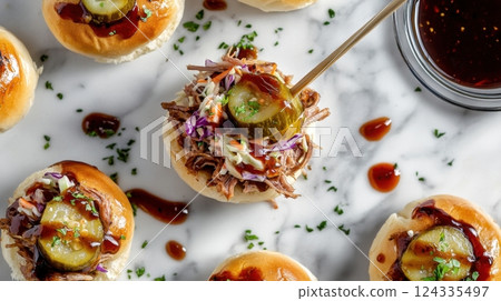 National BBQ Week Pulled pork sliders with pickles and coleslaw on marble surface 124335497