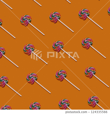 Colorful lollipops pattern on orange background. Candy concept. Sweet colorful food background. Colorful lollipops pattern on orange background. Candy concept. Sweet colorful food background. 124335566