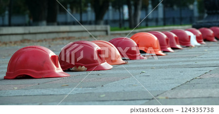 Kiev, Ukraine September 26, 2020: Workers' helmets lined up in a square in protest 124335738