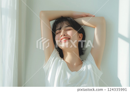 A woman greeted by a refreshing morning 124335991