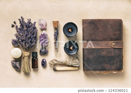 Flat Lay of Lavender, Crystals, and Vintage Journal for Wellness 124336021