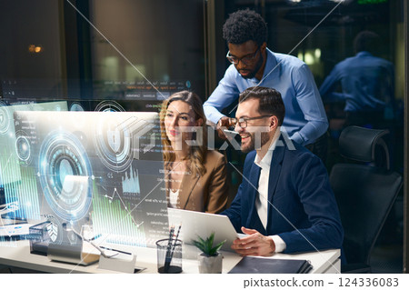 Team of Professionals Working on Futuristic Data Analysis in Modern Office Environment 124336083
