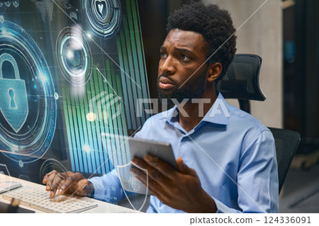 Cybersecurity Professional Using Technology Interface for Data Protection and Analysis in Office Cybersecurity Professional Using Technology Interface for Data Protection and Analysis in Office 124336091