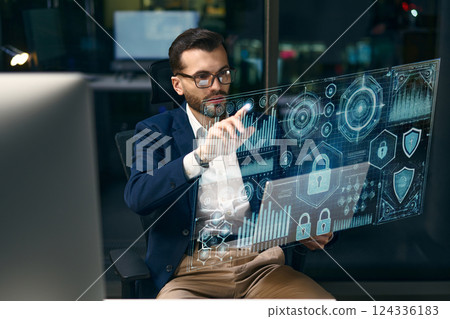 Businessman Analyzing Data on Futuristic Digital Interface in a Modern Office Setting 124336183