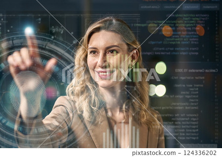 Businesswoman Interacting With Digital Screen Showing Data Charts and Technology Interface Businesswoman Interacting With Digital Screen Showing Data Charts and Technology Interface 124336202